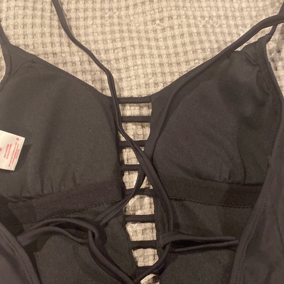 One piece black bathing suit.  High legged on bottom - Picture 5 of 5